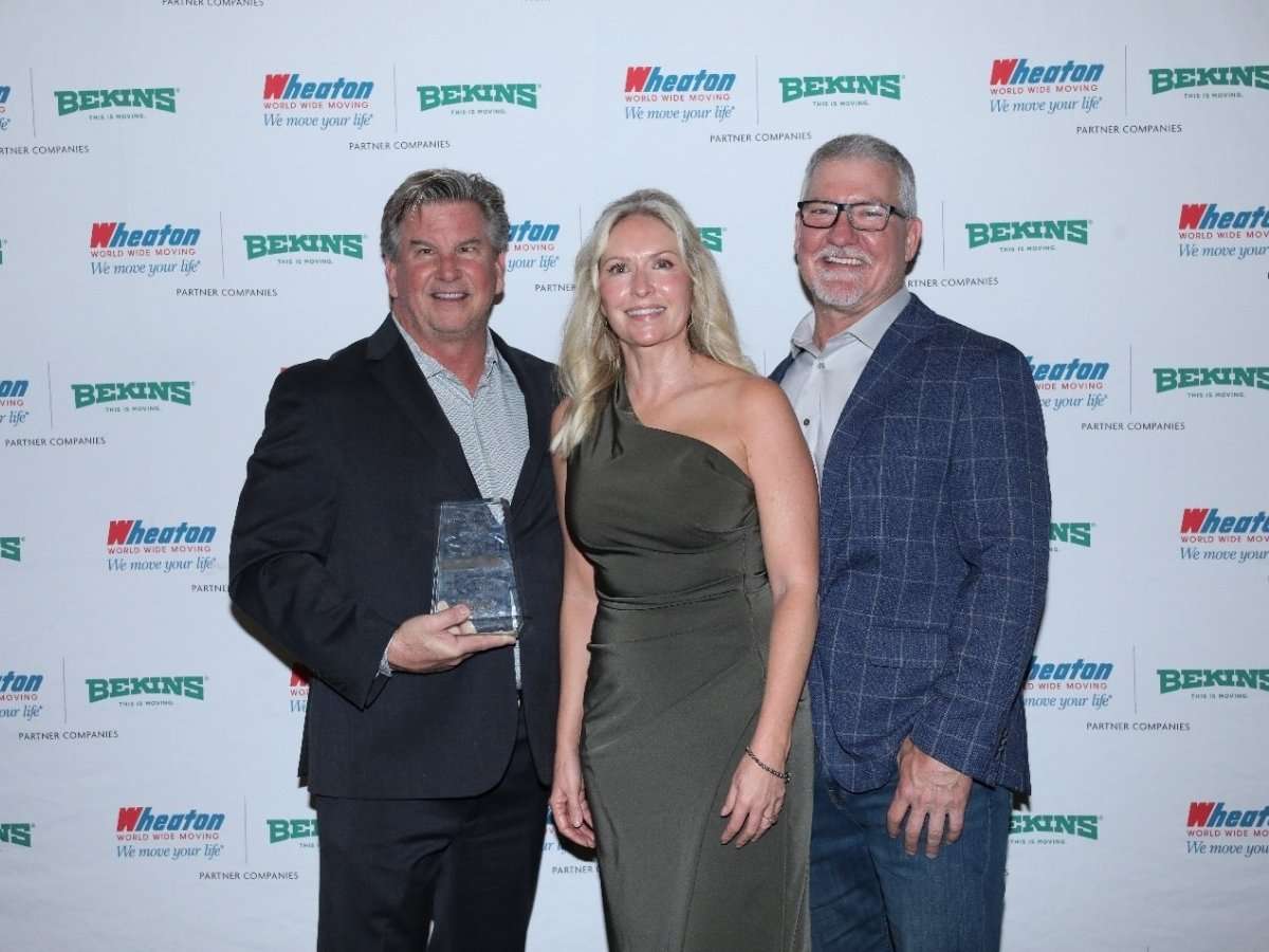 Grace Moving team holding the Wheaton AOTY award for 2025